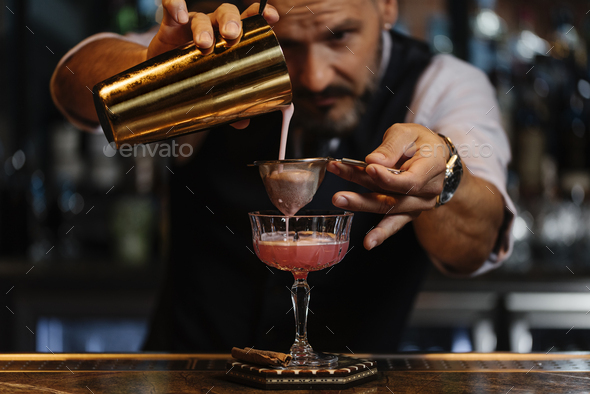 Portrait of expert handsome barman. - Stock Photo - Images