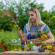 Woman with medicinal herbs and tinctures. Selective focus. - PhotoDune Item for Sale