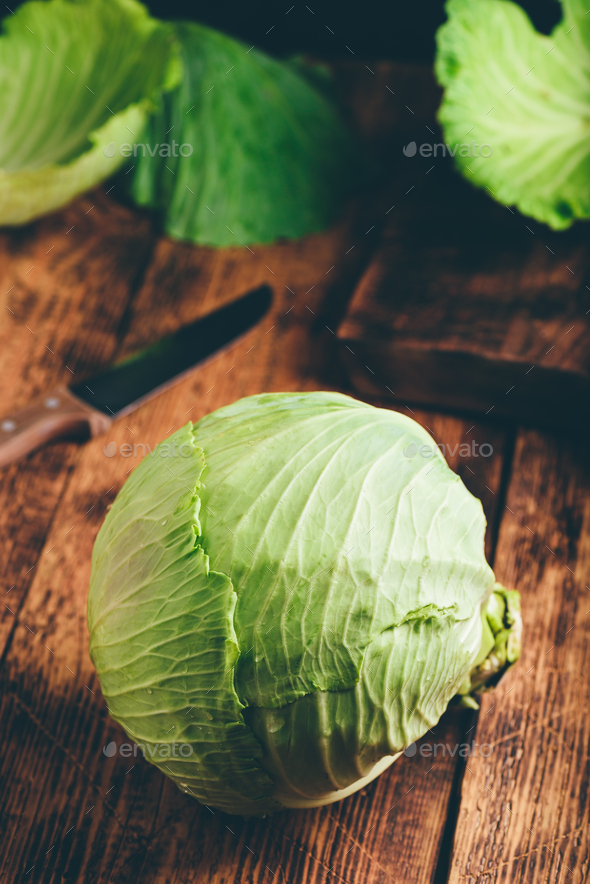 White Cabbage on Wooden Table - Stock Photo - Images