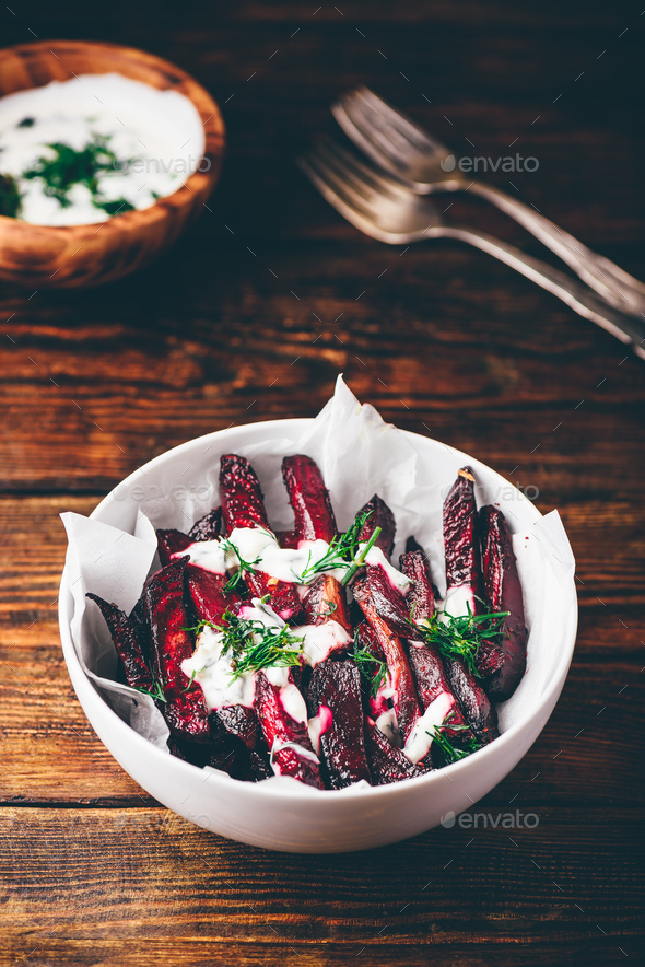 Oven baked beet with yogurt and dill dressing - Stock Photo - Images