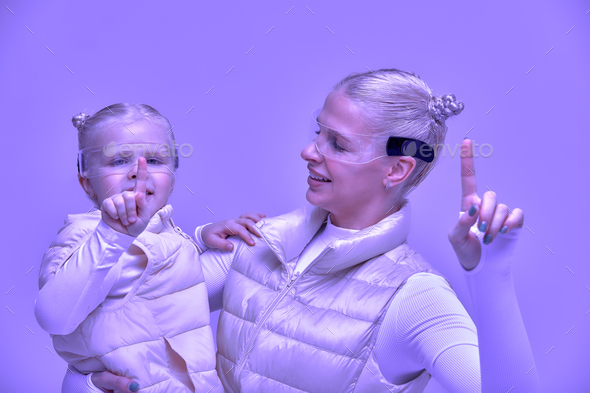 young woman with little girl wearing head mount display and futuristic GUI, smart glasses, graphical