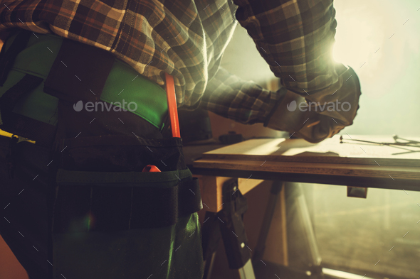 Handyman Working Inside His Small Workshop - Stock Photo - Images