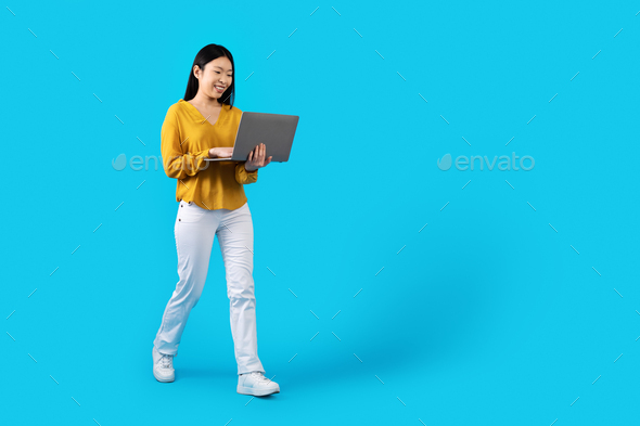 Positive japanese woman freelancer working from home, using gadgets Stock  Photo by Prostock-studio