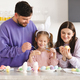 Happy family making Easter decorations together at home - PhotoDune Item for Sale