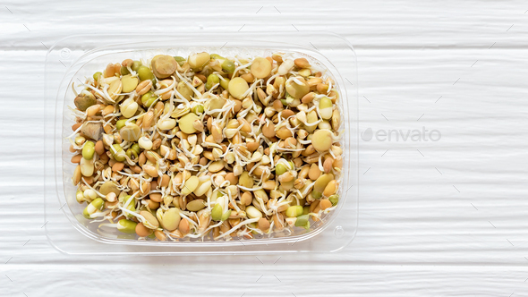 Healthy diet and vegetarian food. Mix of fresh sprouts on white background. macrobiotic food