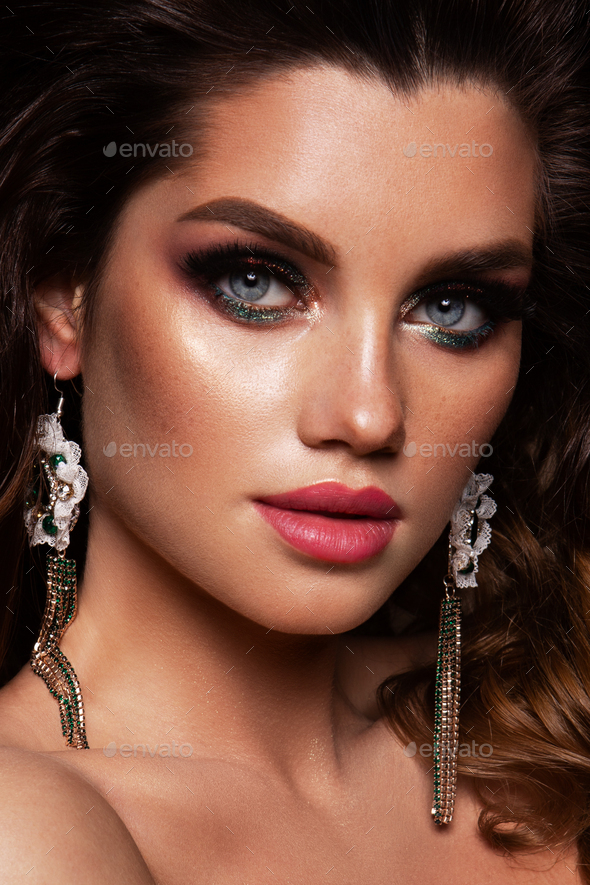Glamour portrait of beautiful girl model with makeup and romantic hairstyle. Fashion shiny - Stock Photo - Images
