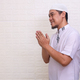Smiling Asian Muslim man gesturing Eid Mubarak greeting  - PhotoDune Item for Sale