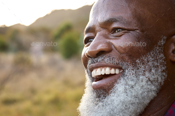 Close Up Portrait Of Smiling Senior Man Outdoors In Countryside - Stock Photo - Images