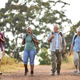 Group Of Active Senior Friends Enjoying Hiking Through Countryside Walking Along Track Together - PhotoDune Item for Sale