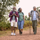 Group Of Active Senior Friends Enjoying Hiking Through Countryside Walking Along Track Together - PhotoDune Item for Sale