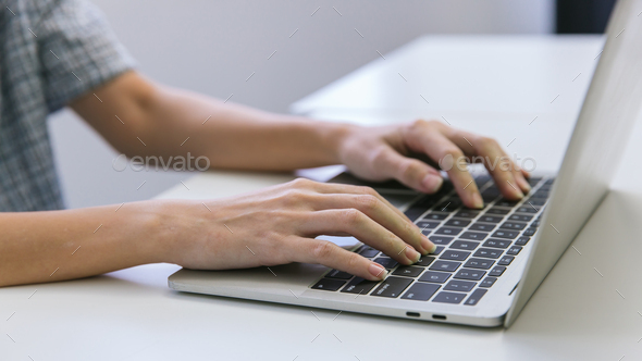 Woman hand using laptop or computor searching for information in internet online society web.