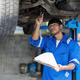 Portrait Shot of a Handsome Mechanic Working on a Vehicle in a Car Service. Professional Repairman - PhotoDune Item for Sale