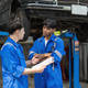 Two Mechanics in a Service are Inspecting a Car After They Got the Diagnostics Results. Female - PhotoDune Item for Sale