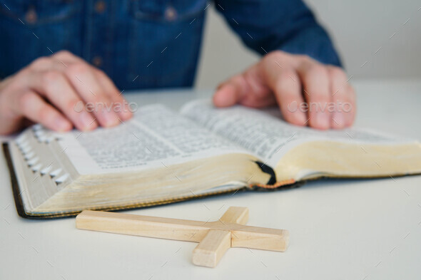 Christian catholic man concentrate on reading Holy Bible at home. Sunday readings. - Stock Photo - Images