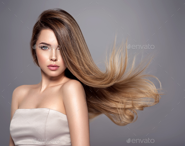 Young woman with long straight hair. Blond girl. - Stock Photo - Images