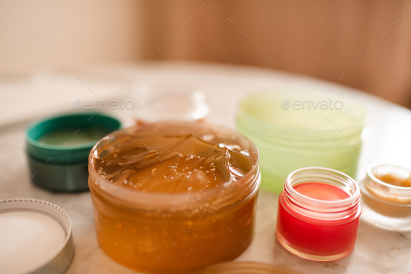 Snail mucin gel with health care products in bathroom closeup - Stock Photo - Images