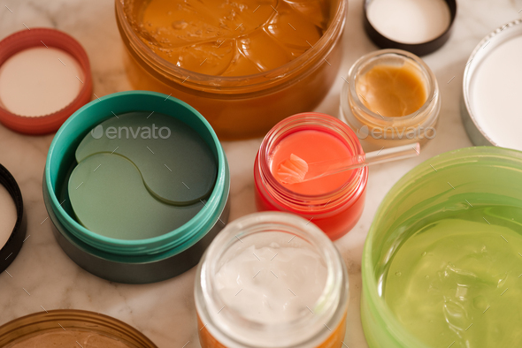 Skin care products on bathroom table close up - Stock Photo - Images