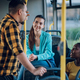 Multiracial friends talking while riding a bus in the city - PhotoDune Item for Sale