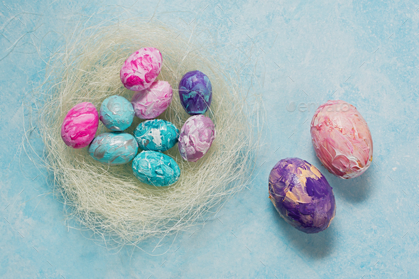 Happy Easter. Easter colorful eggs on a mint wooden background. - Stock Photo - Images