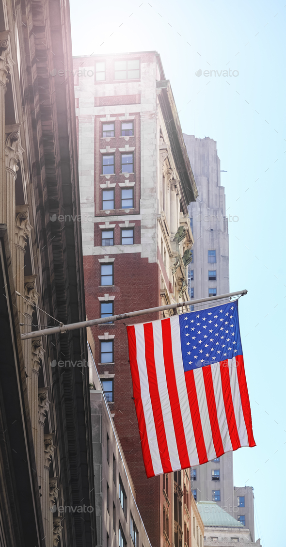 American flag with buildings in background, selective focus, New York City, USA. - Stock Photo - Images