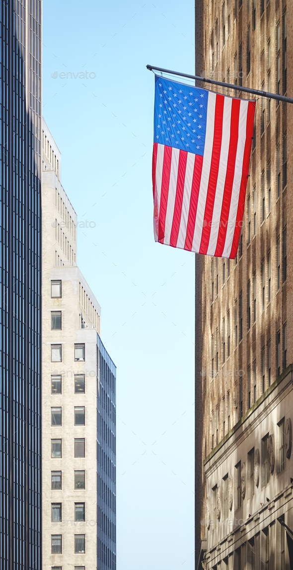 American flag with buildings in background, selective focus, New York City, USA. - Stock Photo - Images