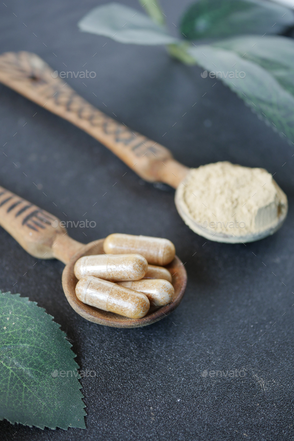 herbal medicine capsule on spoon  - Stock Photo - Images