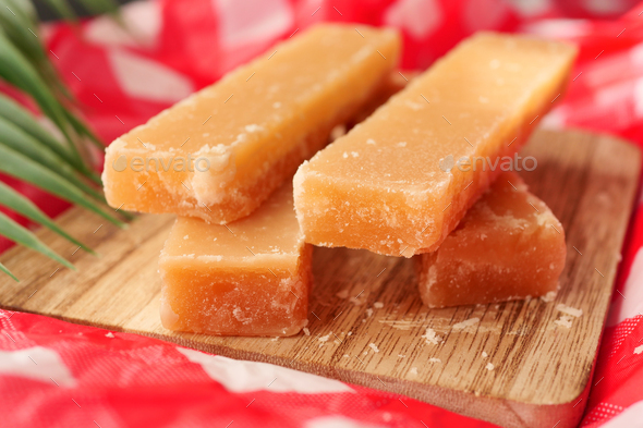  Jaggery traditional cane sugar cube on table  - Stock Photo - Images