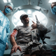 Two doctors and injured soldier looking at camera together - PhotoDune Item for Sale