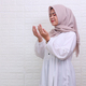 Muslim woman praying dua, arm raised.  - PhotoDune Item for Sale
