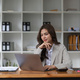 Portrait asian woman working with laptop in her office. business financial concept. - PhotoDune Item for Sale
