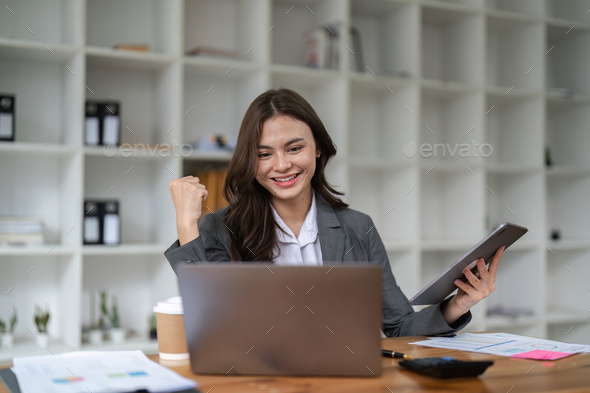 Happy woman office worker feeling excitement raising fists celebrates career ladder promotion or - Stock Photo - Images