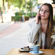 Woman talking on phone in a coffee shop. - PhotoDune Item for Sale