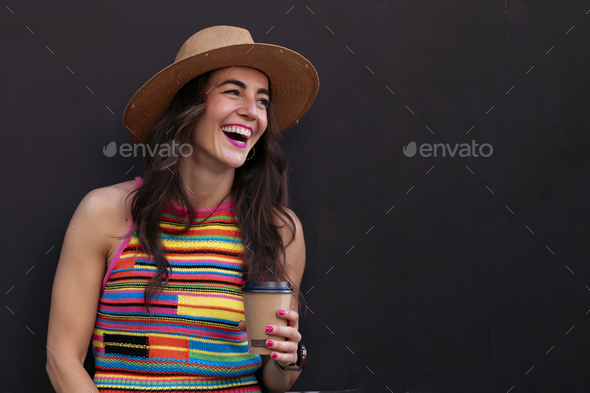 Happy smiling woman holding a recyclable cardboard cup. - Stock Photo - Images