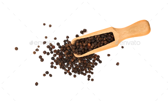 Wooden scoop full of black peppercorns