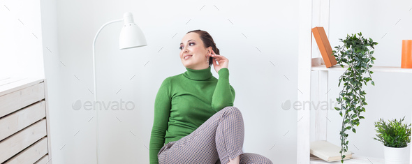 Banner happy emotions woman relaxing on chair at home in sitting room copy space and empty place for - Stock Photo - Images