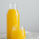 Cold fresh orange juice filled in glassware, full of vitamins, isolated over white background - PhotoDune Item for Sale