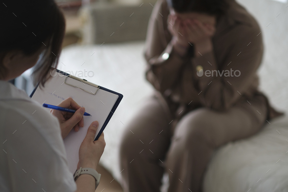 patient makes progress towards healing and recovery as she talks with her therapist about her