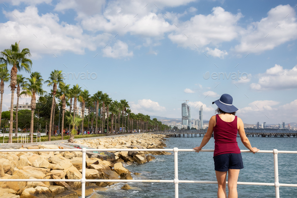 Woman Traveler at Modern Cityscape on the Sea Coast. Limassol, Cyprus. - Stock Photo - Images