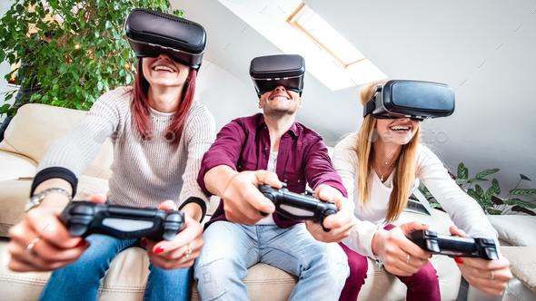 Trendy people playing with vr glasses at shared apartment - Stock Photo - Images