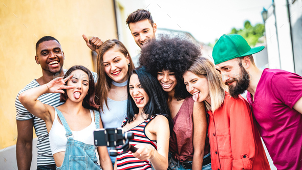 Multi racial friends taking video selfie with mobile phone on stabilize gimbal - Stock Photo - Images