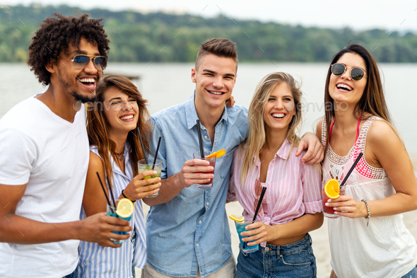Portrait of friends having fun together on beach vacation. Student friend fun happiness concept. - Stock Photo - Images