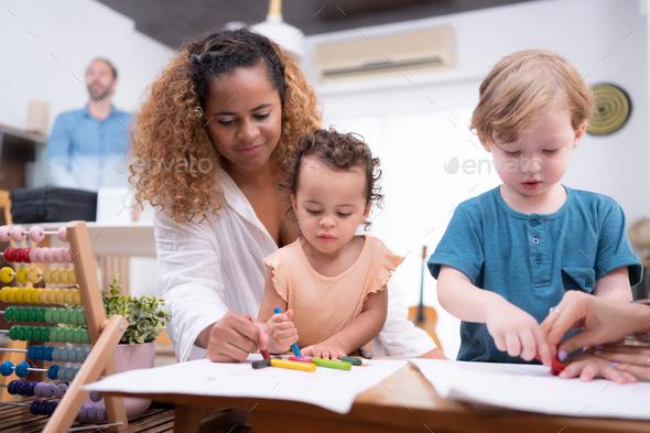 A little child's imagination is represented through colored pencil drawings - Stock Photo - Images