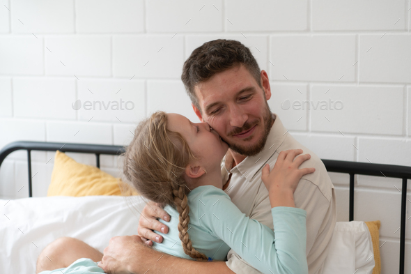 A little girl expresses his feelings for his father. - Stock Photo - Images