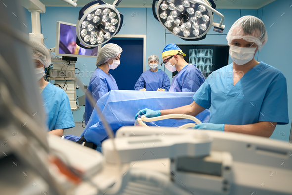 Anesthesiologist at work in a modern operating room Stock Photo by ...