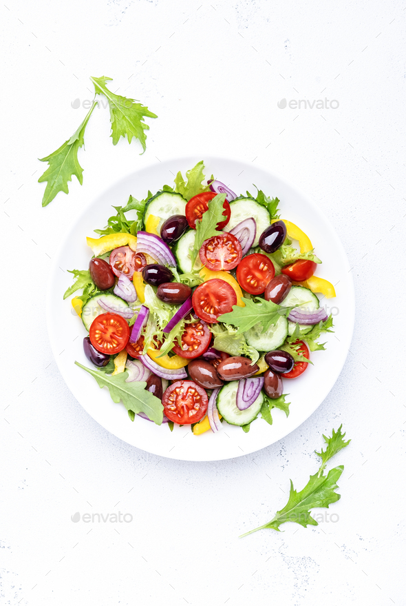 Vegan greek salad with kalamata olives, cherry tomato, yellow paprika, cucumber and red onion - Stock Photo - Images
