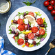Greek salad with feta cheese, kalamata olives, red tomato, yellow paprika, cucumber and onion - PhotoDune Item for Sale