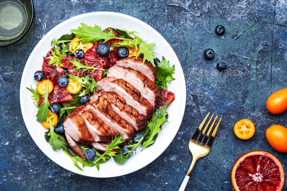 Duck salad with grilled breast with red orange, kumquat, blueberry and chard - Stock Photo - Images