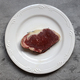 Raw beef meat with on white plate - PhotoDune Item for Sale