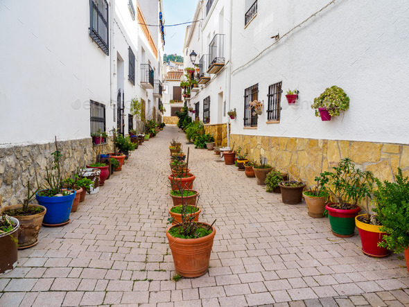 Street with ornamental pots in Hornos de Segura village, Spain - Stock Photo - Images