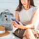 Young woman using mobile phone while traveling for summer vacation - PhotoDune Item for Sale